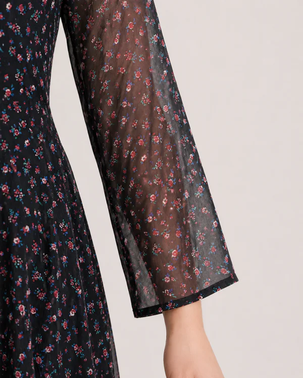 elrare black scatter floral maxi dress seated