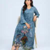 elrare blue botanical bird maxi dress seated