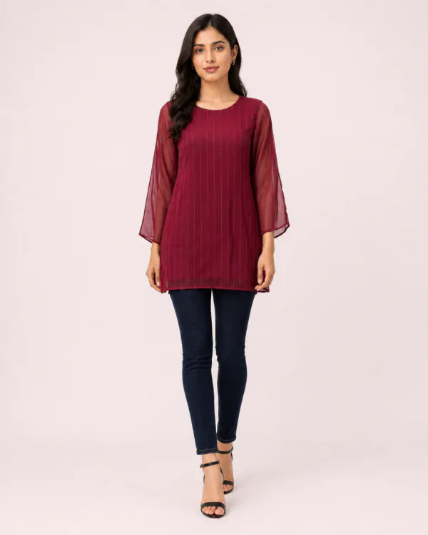 elrare burgundy pintuck flutter sleeve top walking pose