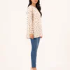 elrare cream polka dot bell top side view