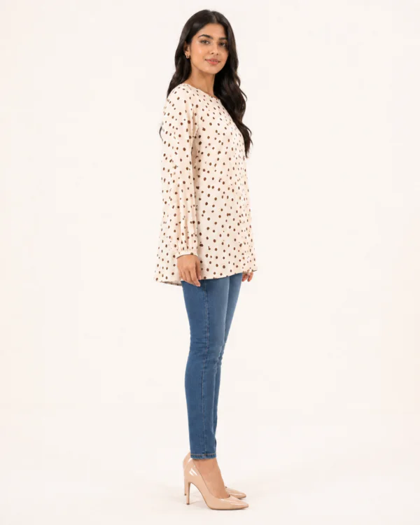 elrare cream polka dot bell top side view