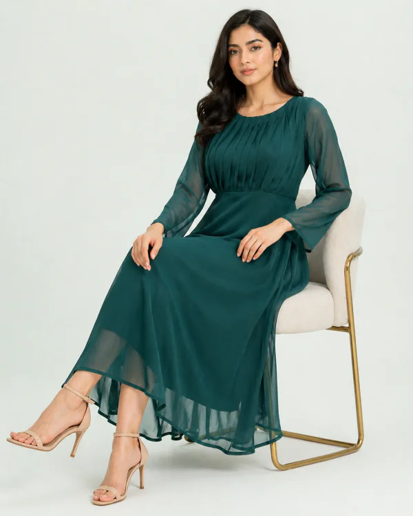 elrare emerald green chiffon maxi dress seated