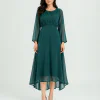 elrare emerald green chiffon maxi dress walking pose