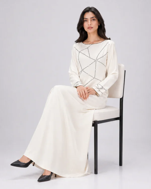 elrare ivory geometric line maxi dress seated