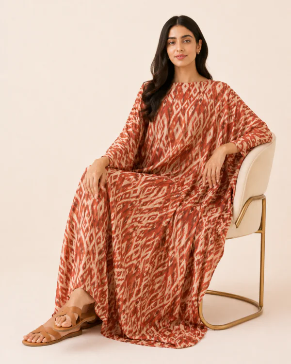 elrare rust ikat print kaftan seated