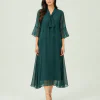elrare teal bow tie chiffon maxi dress walking pose