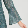 elrare teal scatter floral maxi dress seated