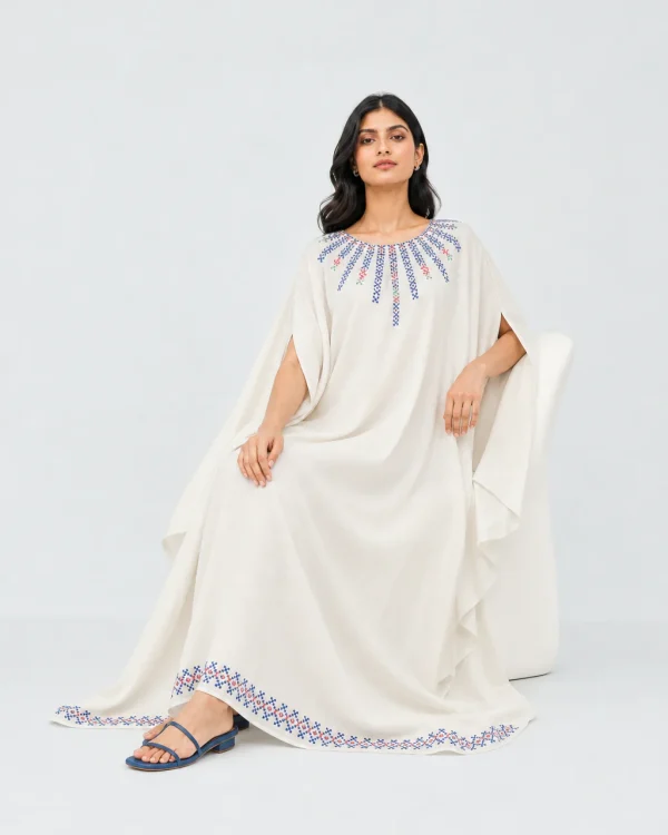 elrare ivory blue cross stitch kaftan seated